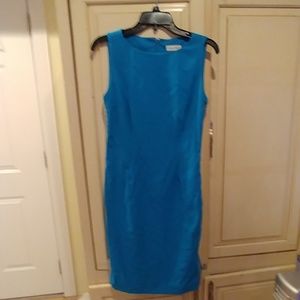 Beautiful aqua color dress w gold accents on side